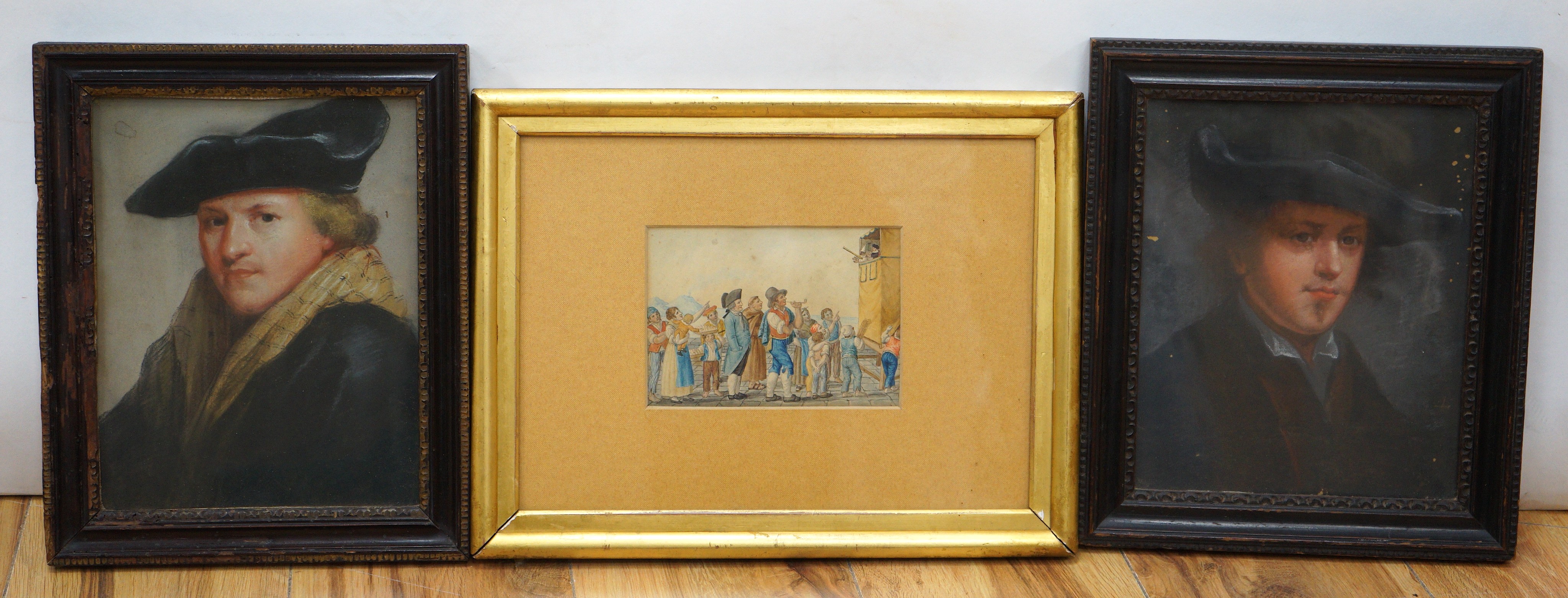 Dutch School, two pastel portraits of gentleman, one monogrammed EL, 24 x 18cm and a small watercolour of 18th century figures watching a Punch and Judy show